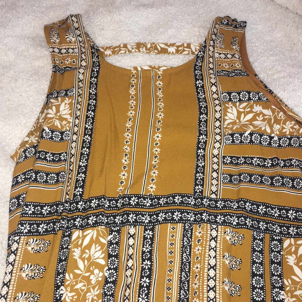 Mid length, yellow, floral dress.